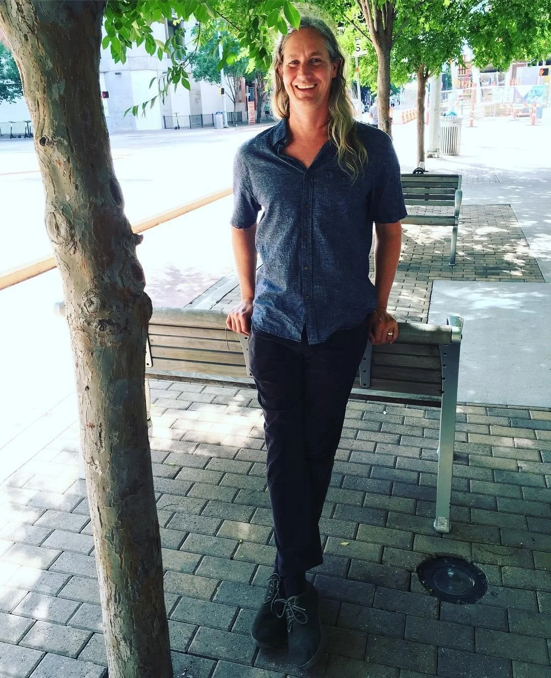 Billy O&rsquo;Leary standing outdoors on a tree-lined street.